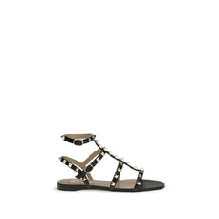 Valentino Garavani Schwarze flache Sandalen aus Kalbsleder Bos Taurus