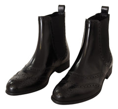 Dolce & Gabbana Schwarze knöchelhohe flache Lederstiefeletten