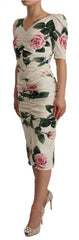 Dolce & Gabbana Plissiertes Kleid aus Stretch-Seide mit weißen Rosenmuster