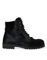 Dolce & Gabbana Schwarze kniehohe Stiefel aus Leder im Pony-Stil