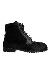 Dolce & Gabbana Schwarze kniehohe Stiefel aus Leder im Pony-Stil