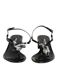 Dolce & Gabbana Schwarze Leder-Sandalen mit Knöchelriemen und Kristallverzierung