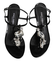 Dolce & Gabbana Schwarze Leder-Sandalen mit Knöchelriemen und Kristallverzierung