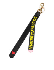 Dolce & Gabbana Schlüsselanhänger aus schwarzem und gelbem Leder mit Logo aus Messing