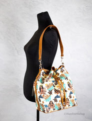 Dooney & Bourke Disney Medium Moana Coated Cotton Bucket Crossbody Bag Handtasche