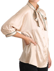 Dolce & Gabbana Beige Seiden-Stretch-Oberteil mit Schleifenbesatz