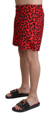 Dolce & Gabbana Rote gemusterte Strandmode Shorts Bademode
