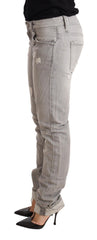 Acht Graue, zerrissene Baumwoll-Slim-Fit-Damenjeans mit umgeschlagenem Saum