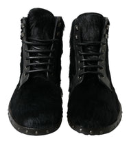 Dolce & Gabbana Schwarze kniehohe Stiefel aus Leder im Pony-Stil
