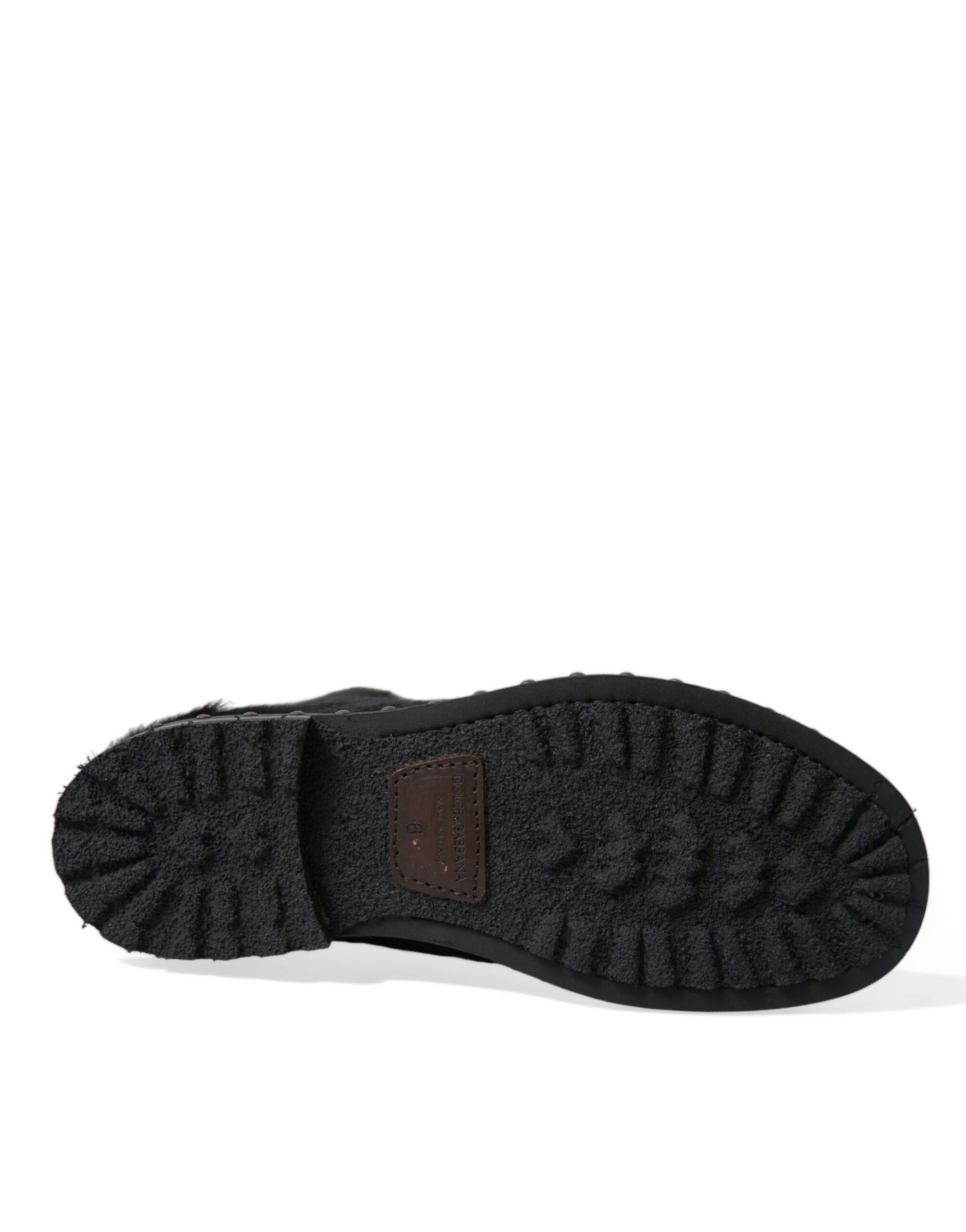 Dolce & Gabbana Schwarze kniehohe Stiefel aus Leder im Pony-Stil