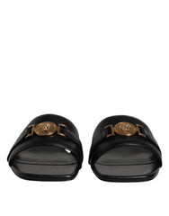 Versace – Schwarze Slipper aus Leder mit Logo-Schild