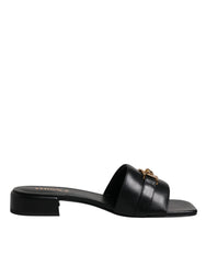 Versace – Schwarze Slipper aus Leder mit Logo-Schild