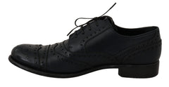 Dolce & Gabbana Dunkelblaue Oxford-Slipper mit Flügelkappen aus Leder