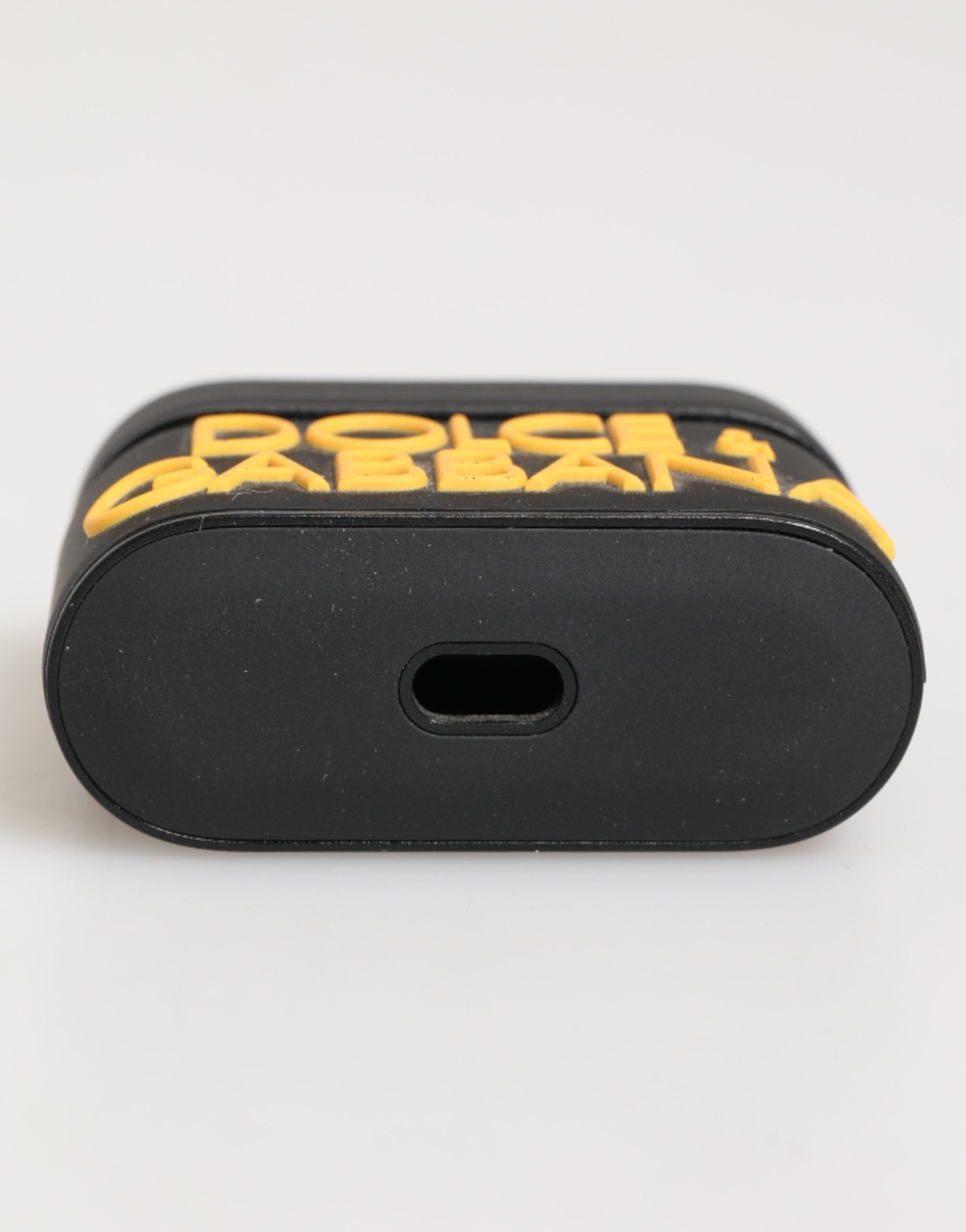 Dolce & Gabbana Schwarzes gelbes Gummi-Logo geprägtes Accessoire Airpods Hülle