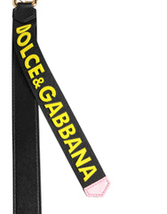 Dolce & Gabbana Schlüsselanhänger aus schwarzem und gelbem Leder mit Logo aus Messing